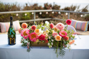 coral and peach sweetheart table arrangement